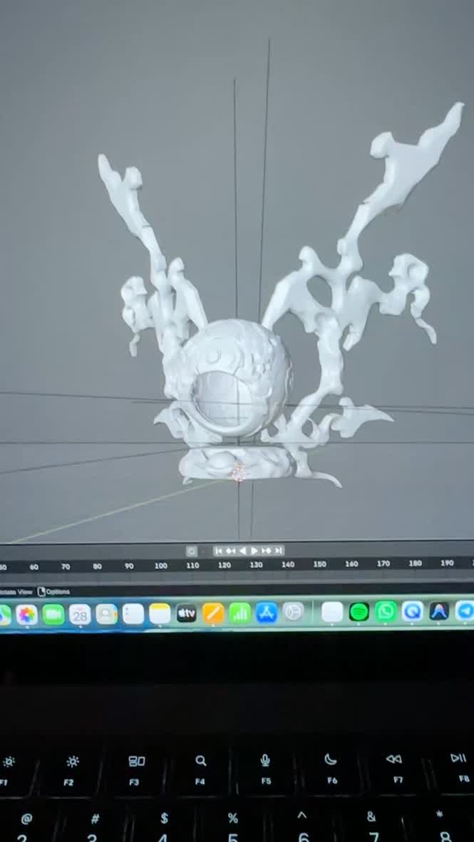 3D modeling software showing the angel sculpt with central sphere and organic wing forms