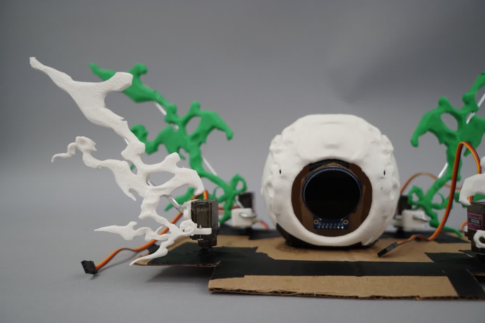 Work in progress: 3D printed wings being attached to servo motors on the central sphere